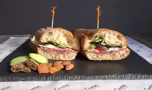 Genoa Peppered Salami +Olive Oil + Cavern Selected Cheese + Tomatoes + Greens + Baguette- Code#: PM8028